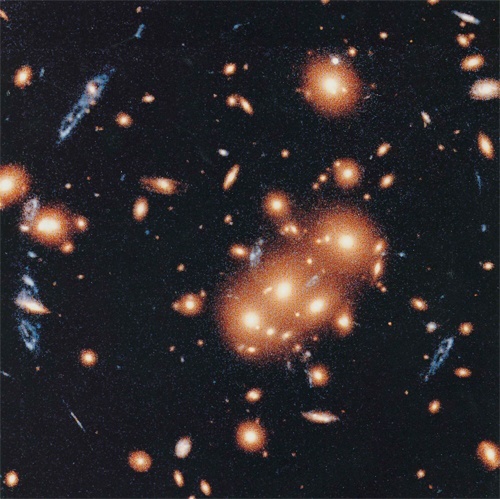 Galactic Cluster Focuses Blue Galaxy Light